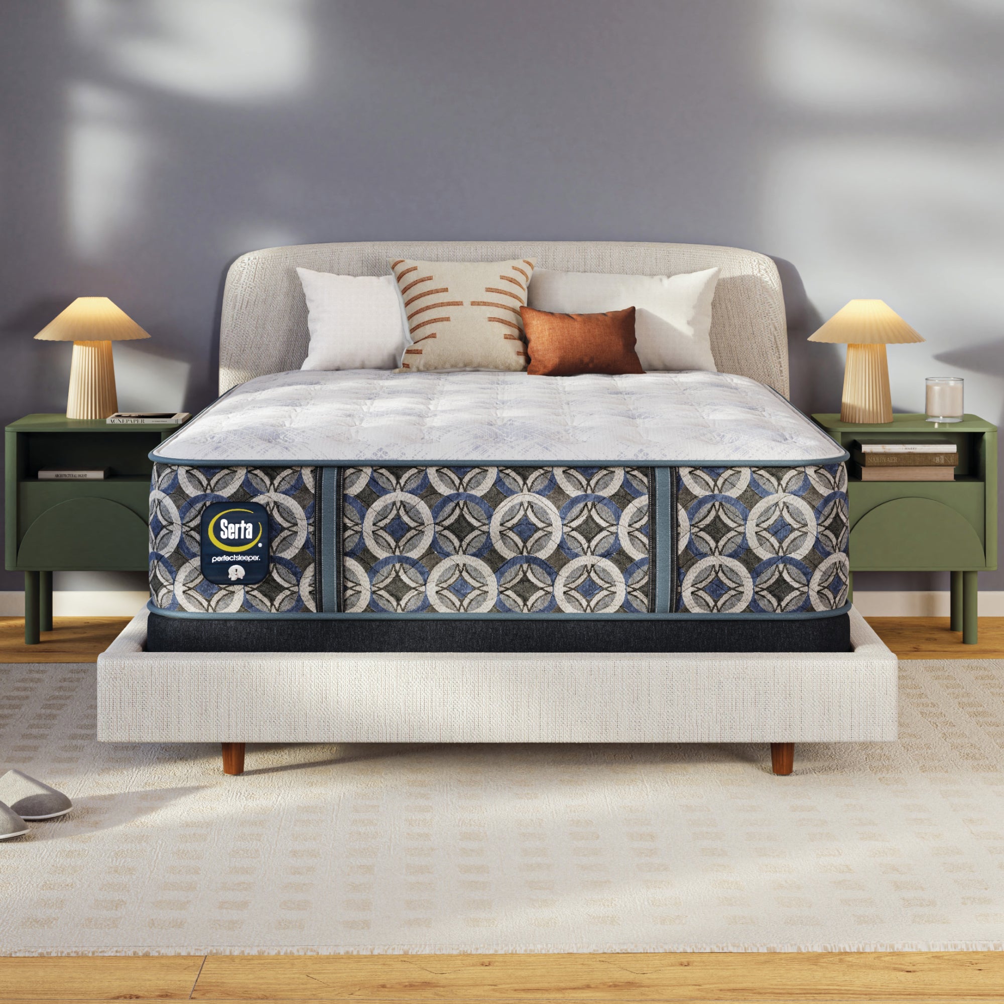Serta perfect sleeper plush mattress on a bed in a bedroom setting with a Serta logo.