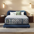 Blue upholstered bed with a Serta perfect sleeper hybrid medium  mattress in a bedroom setting