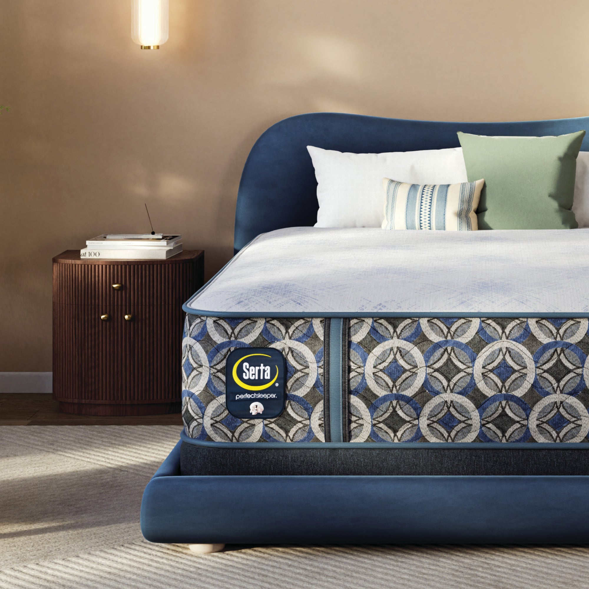 Serta perfect sleeper hybrid medium  mattress with decorative headboard and pillows in a bedroom setting