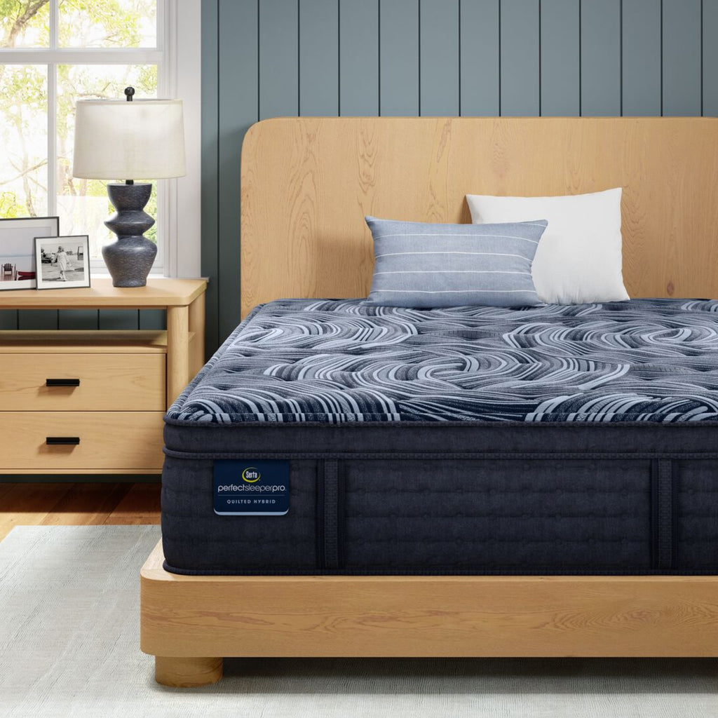 Perfect Sleeper Pro Valais Plush Pillow Top mattress sitting in a brown bedframe || Level: Level 3 || Feel: Plush Pillow Top
