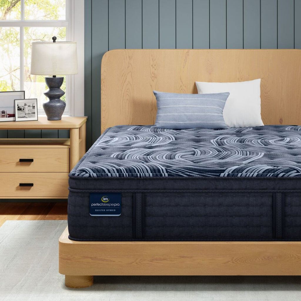 Perfect Sleeper Pro Valais Plush Pillow Top mattress sitting in a brown bedframe || Level: Level 3 || Feel: Plush Pillow Top
