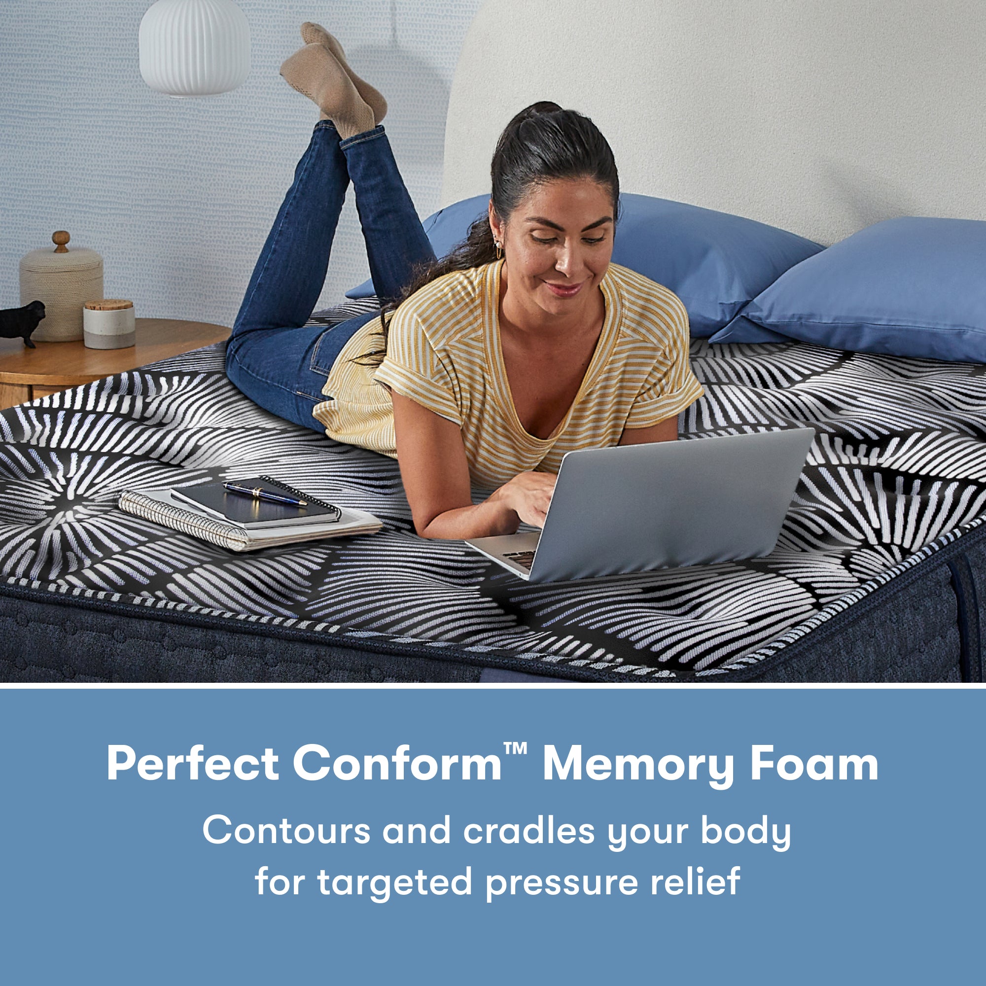 Woman laying on her stomach using her laptop on a Perfect Sleeper X Quilted Hybrid Knox Plush Mattress || feel: Plush || level: Level 1