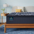 Perfect Sleeper X Quilted Hybrid Lexton Pillow Top Mattress sitting in a brown bedframe || feel: Medium Pillow Top || level: Level 1