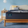 Perfect Sleeper X Quilted Hybrid Max Plush Pillow Top Mattress sitting in a brown bedframe || feel: Plush Pillow Top || level: Level 2
