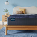 Perfect Sleeper X Hybrid Prescot Plush Mattress sitting in a brown bedframe || feel: Plush || level: Level 2