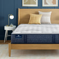 iComfortPro Chelsea Medium Mattress sitting in a brown bedframe || feel: medium || level: Level 1