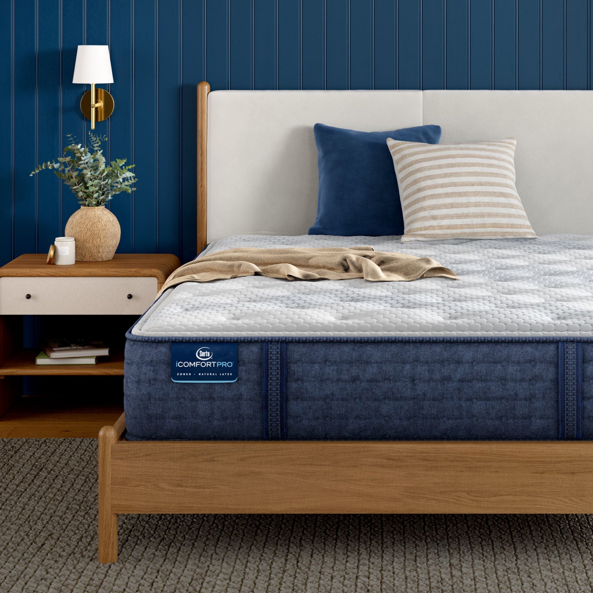 Corner of iComfortPro Ambrose Plush Mattress sitting in a brown bedframe || feel: plush || level: Level 2