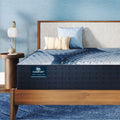 iComfort Iona Medium Mattress sitting in a brown bedframe || feel: medium || level: Standard - 13"