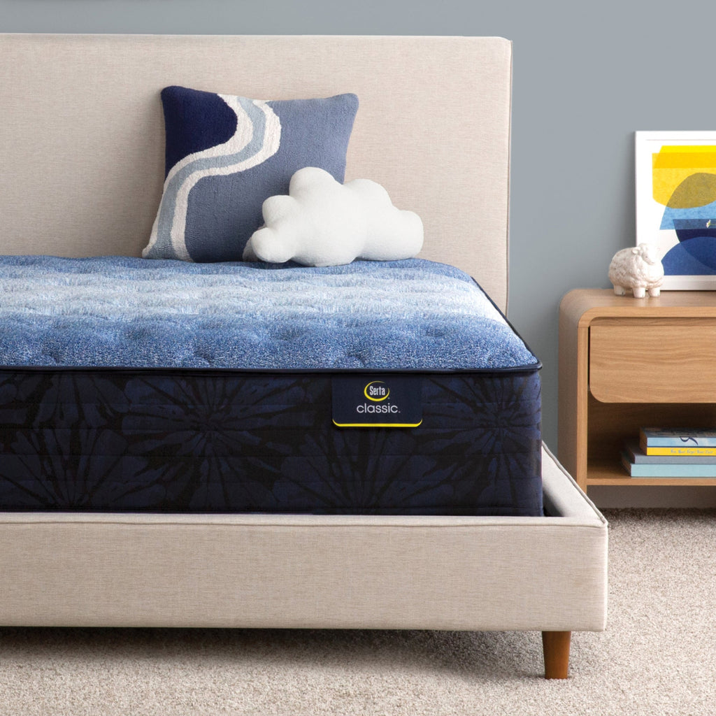 Serta classic brecon medium mattress sitting in a beige bed frame ||feel: medium ||level: enhanced