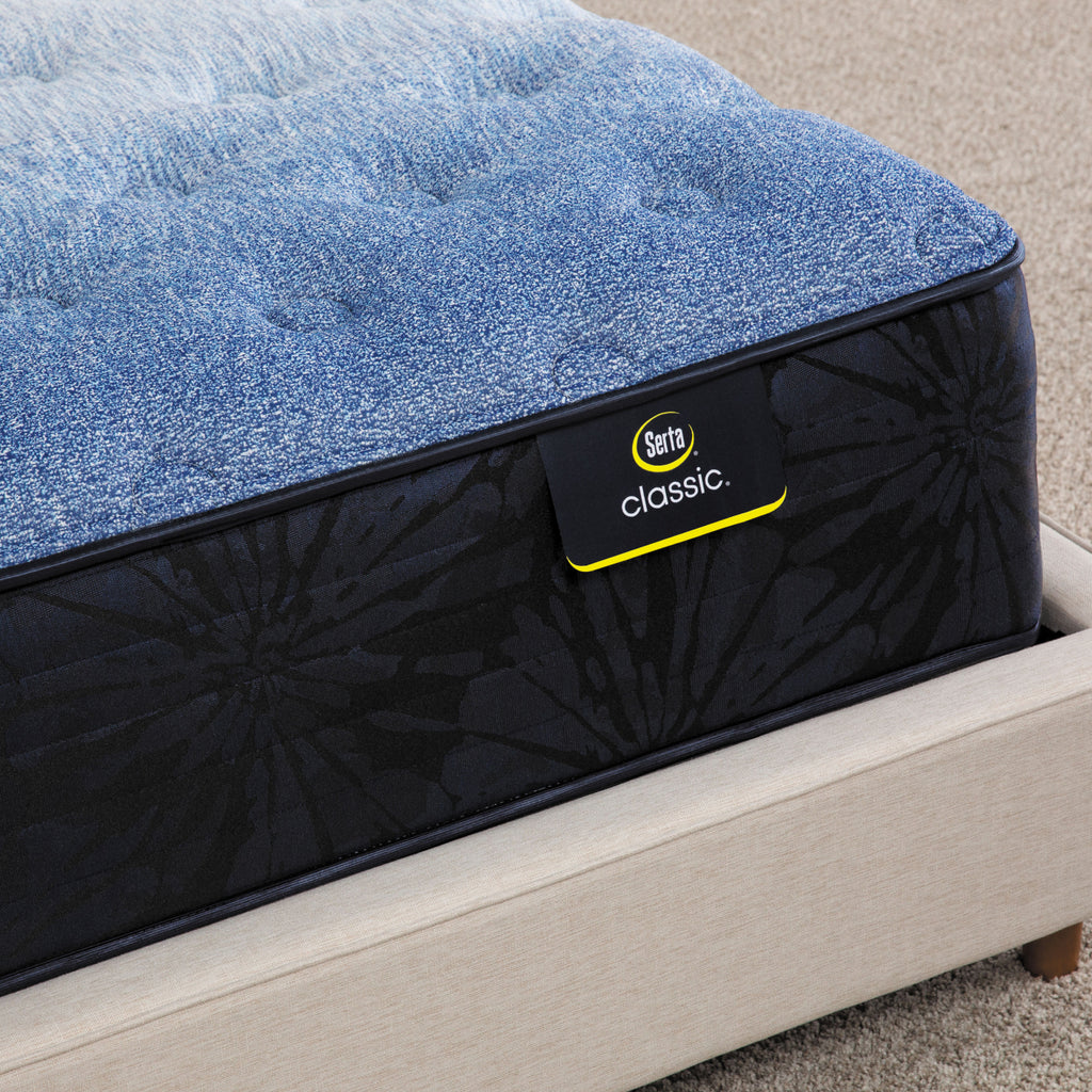 Corner of Serta classic brecon medium mattress sitting in a beige bed frame ||feel: medium ||level: enhanced